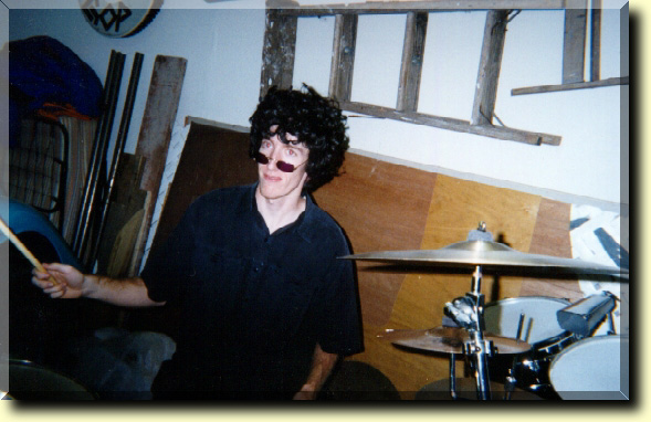 Picture of our drummer, Denny, with a fro wig on.